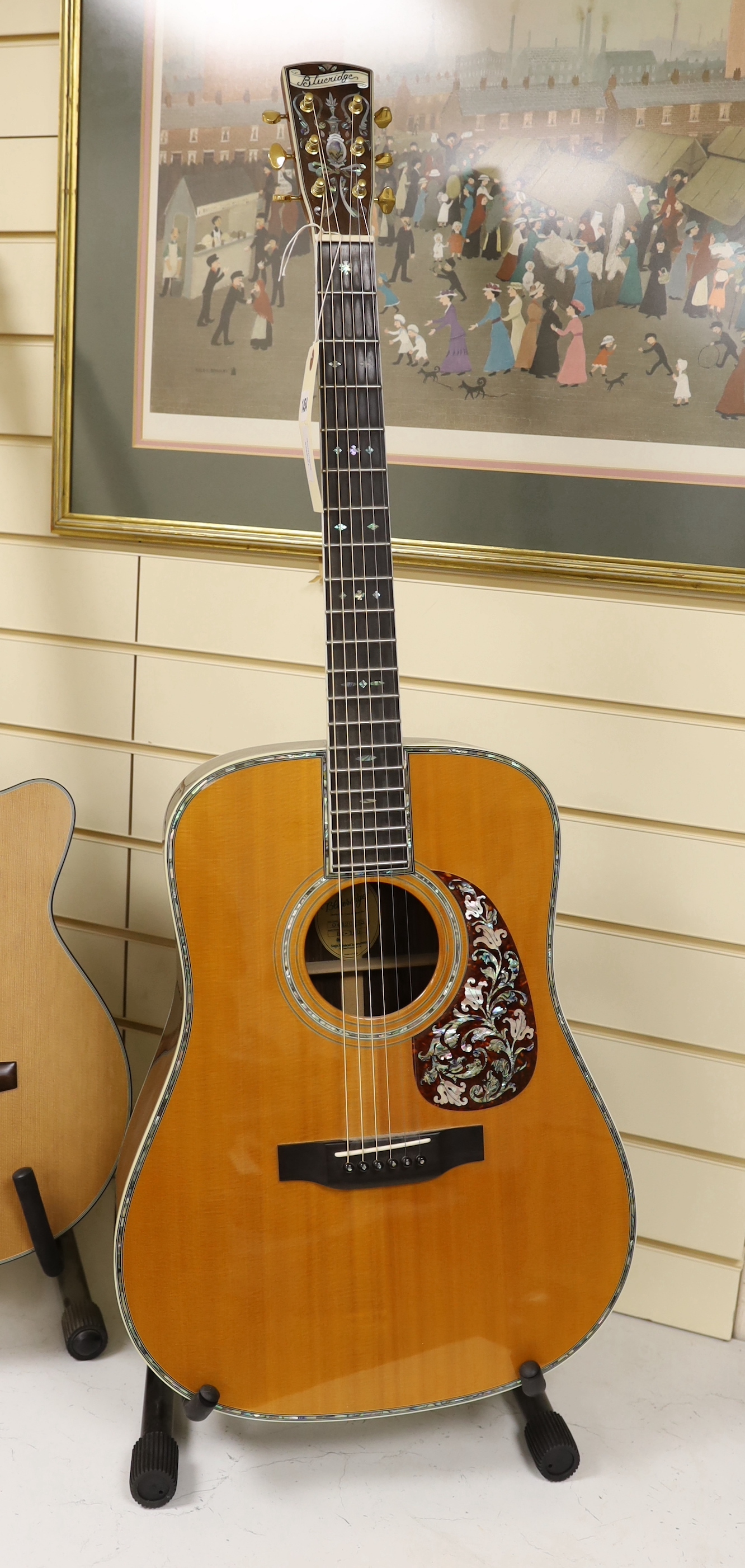 A Chinese made Bluebridge acoustic guitar, serial no.04120253, model no.BR-180, labelled to interior with later embellishments to rosewood case